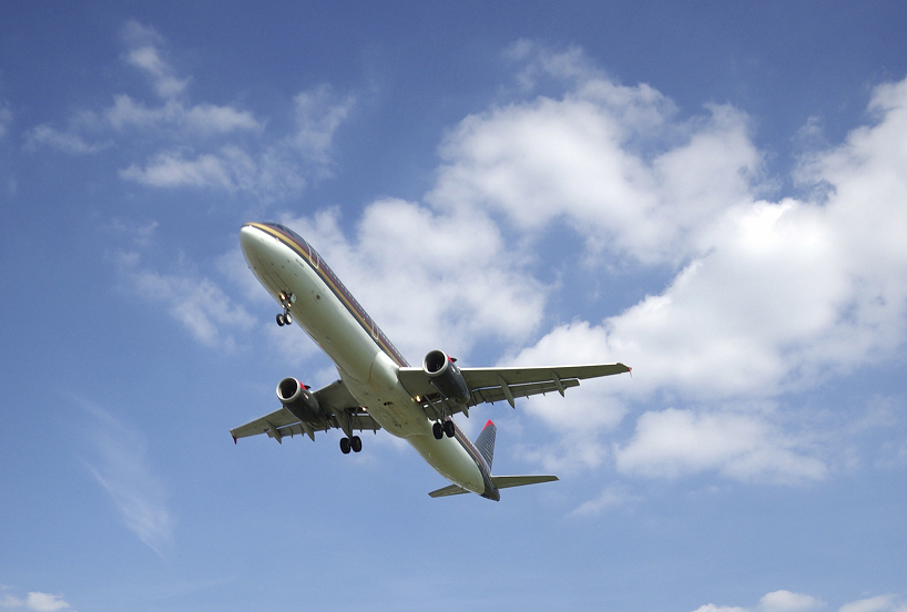 What are the benefits of hiring a minibus for airport runs?
